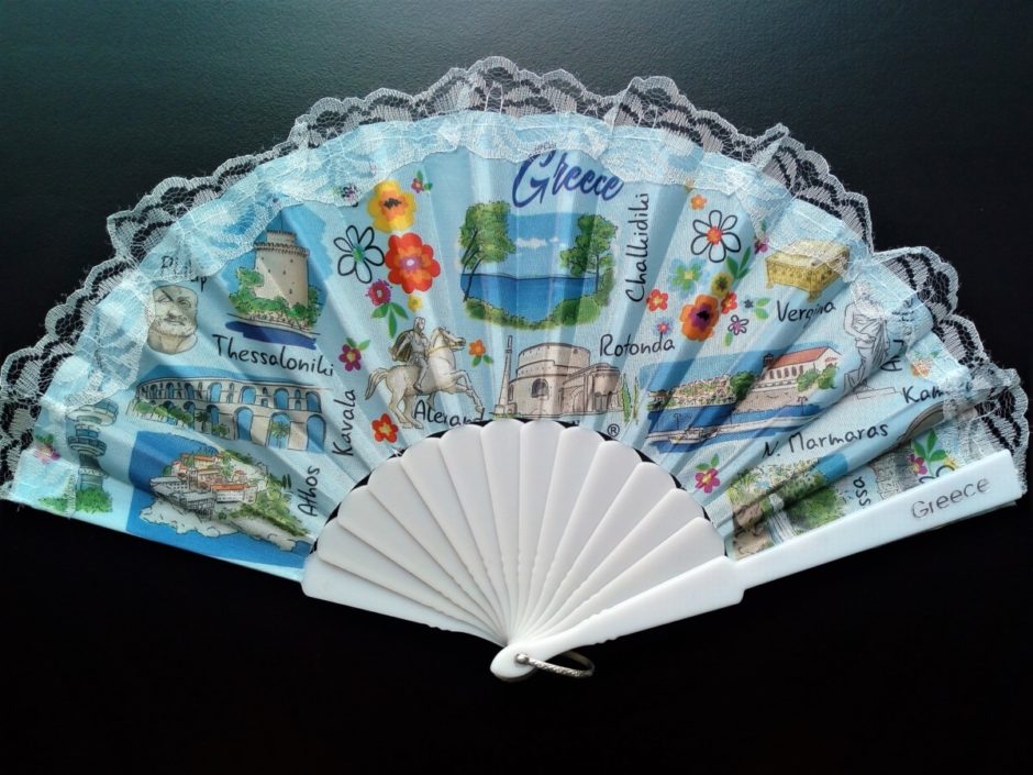Image of a fan with pictures of well known places in Greece on it