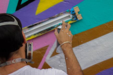 A graffiti artist at work at 7PLY festival